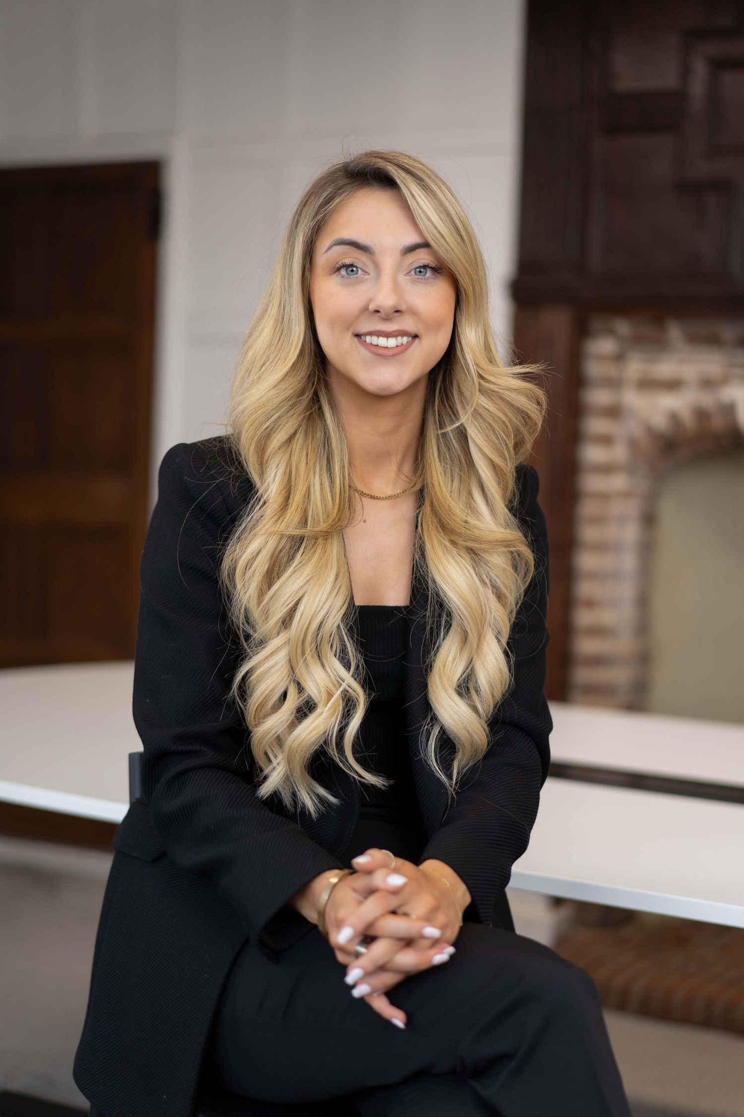 Professional photo shoot of a businesswoman taken in a boardroom during a business branding photography session.