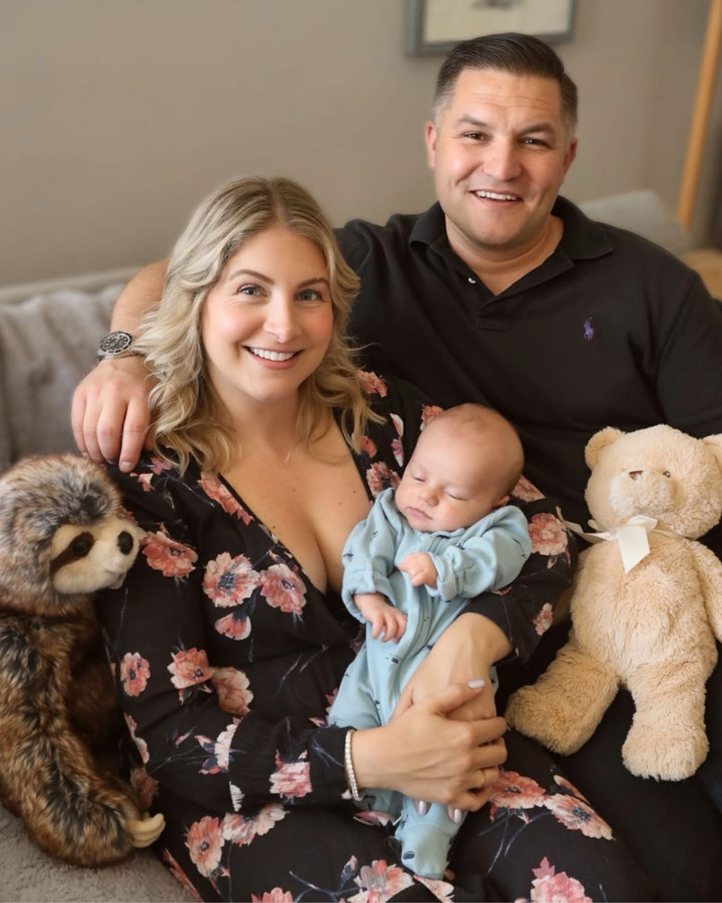 Family of three relaxing on the couch with newborn, unposed and authentic in-home session in the Bay Area.
