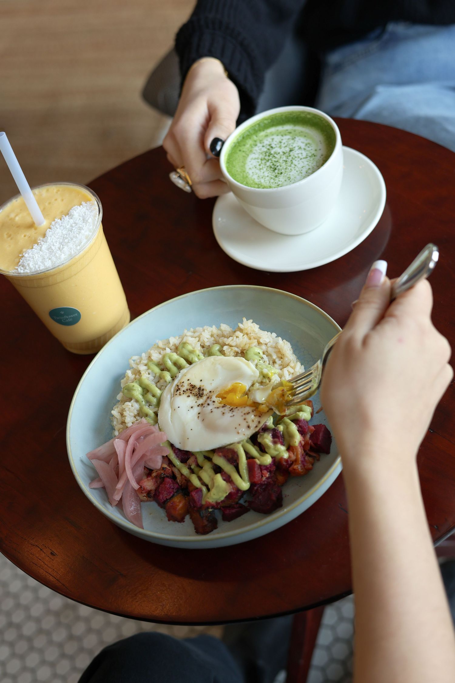 A sequence of photos showing hands eating a breakfast plate with eggs, ham, and avocado alongside a matcha latte.