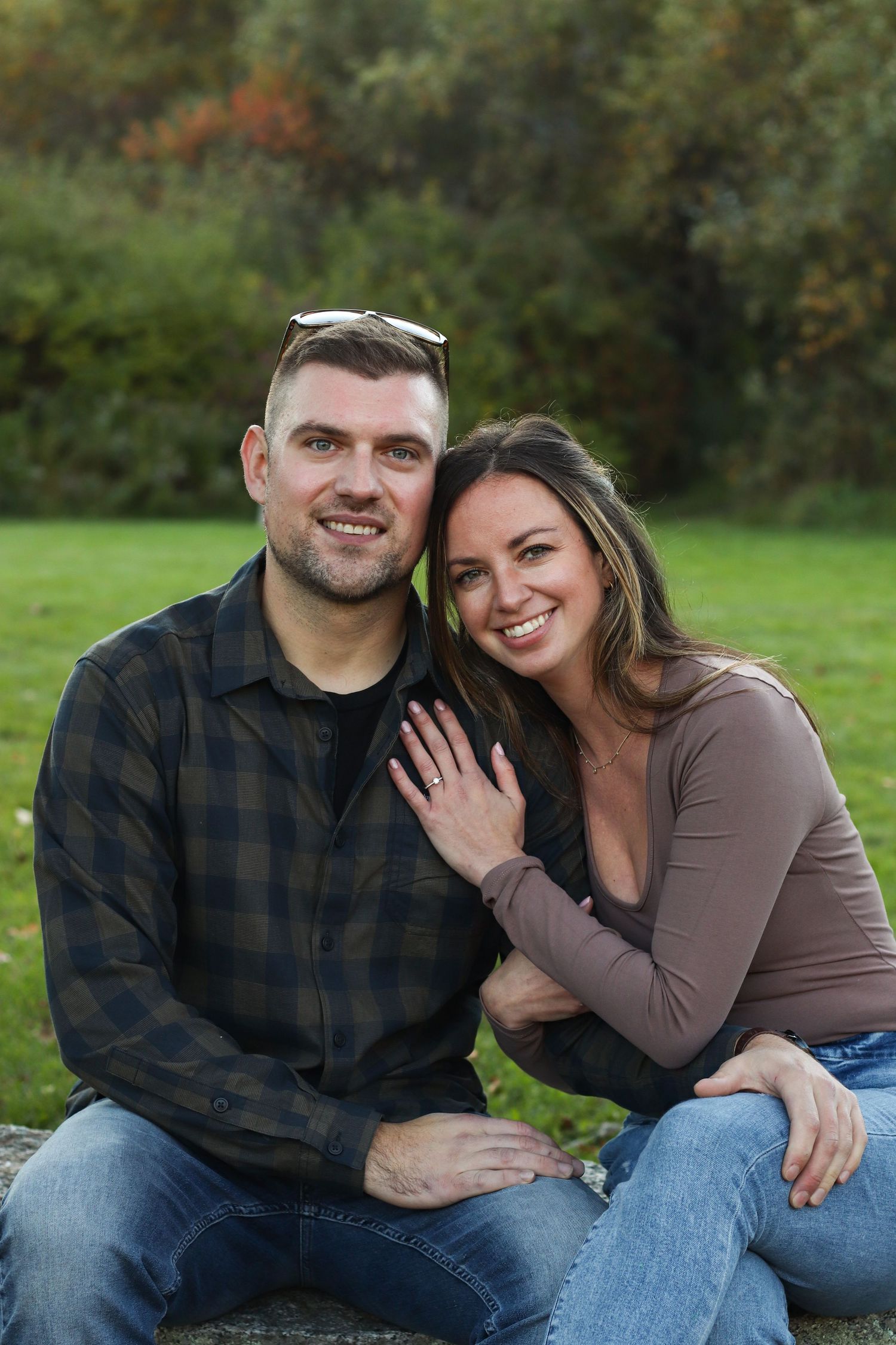 A couple shares intimate moments during an outdoor autumn photoshoot.