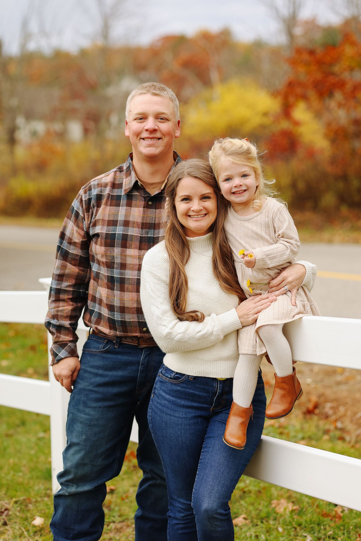 Fall family portraits, family of 3 smiling together