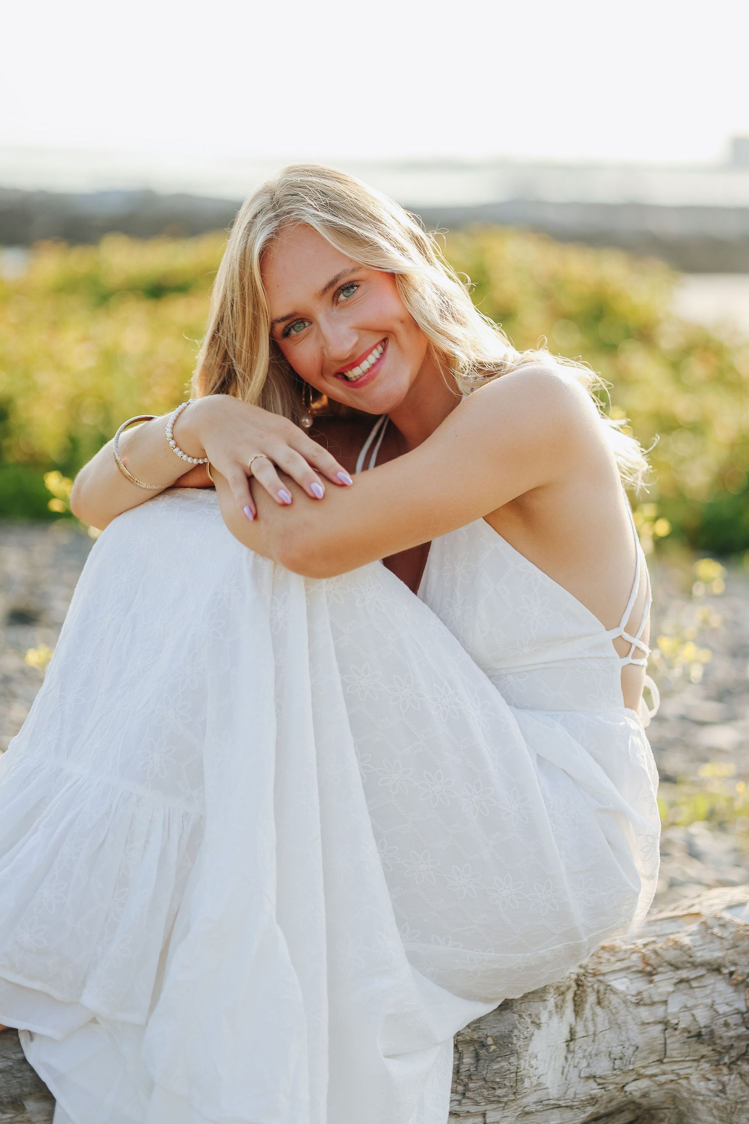 Solo female portrait in white dress at the beach, senior session
