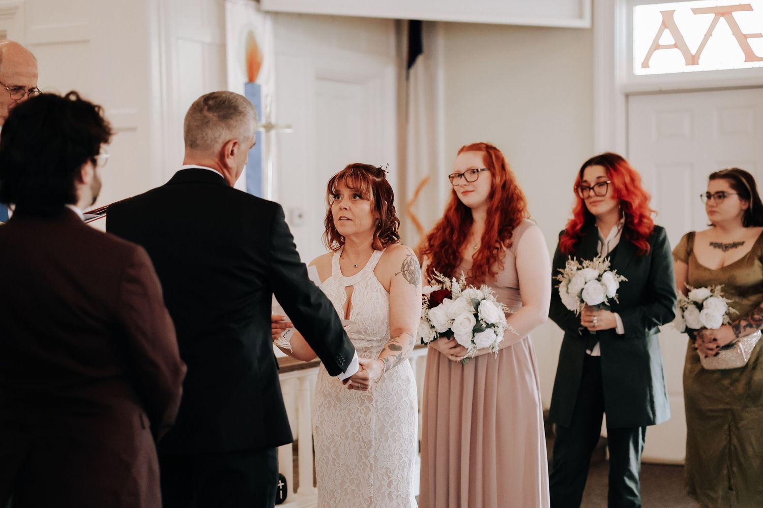 A collage of candid wedding moments shows people mingling and interacting during an indoor reception.