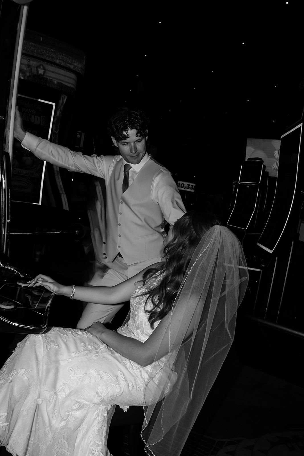Black and white photo of bride and groom sharing a dramatic dance together at their wedding reception.