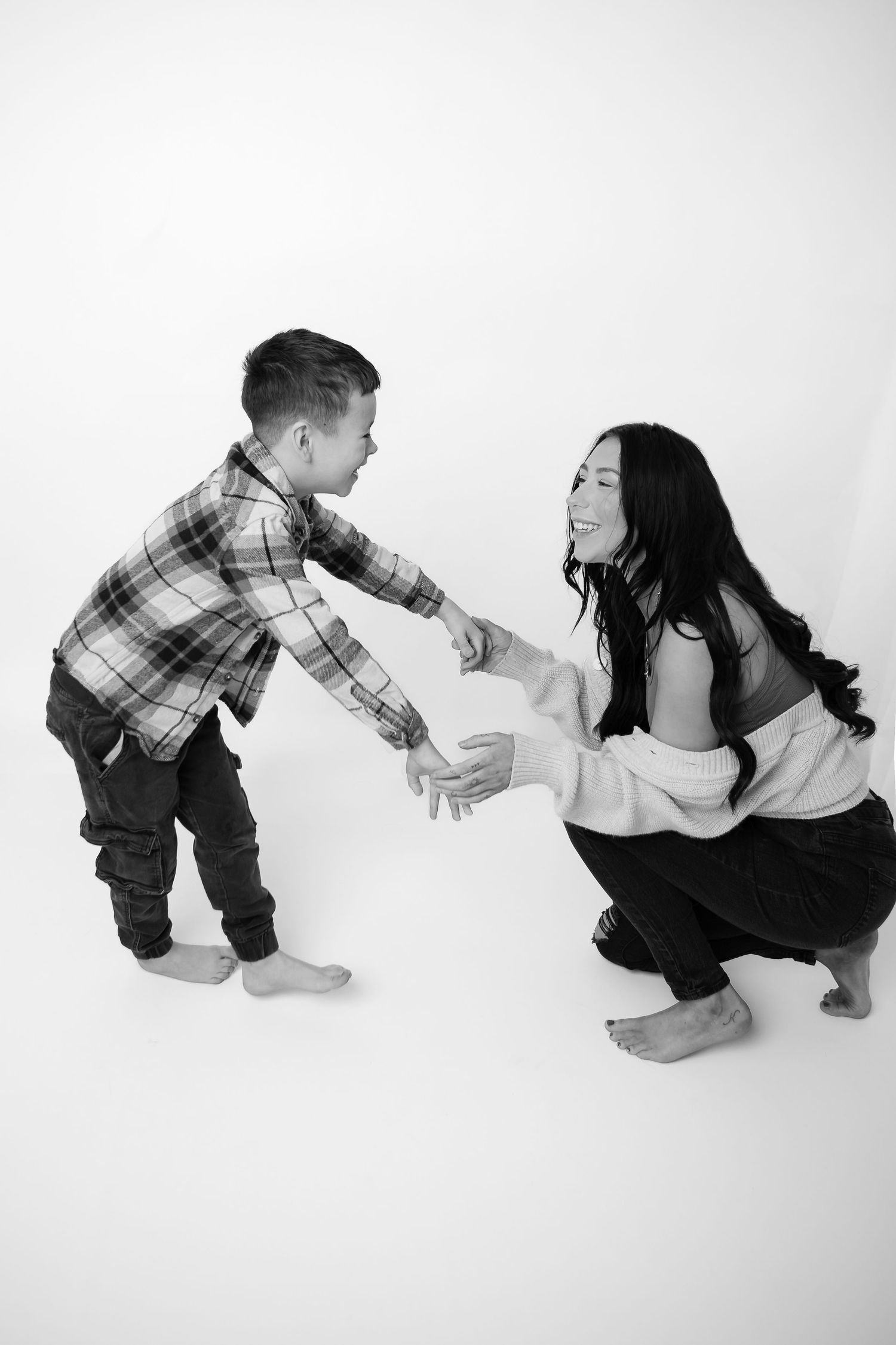 Playful sequence of a child and adult interacting on white background.