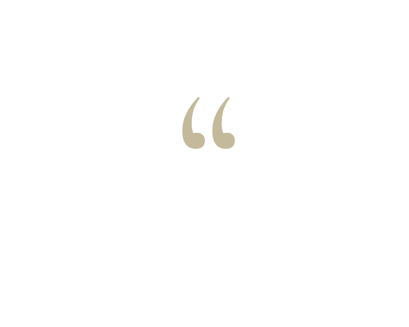 Gold decorative opening quotation marks symbol on a white background.