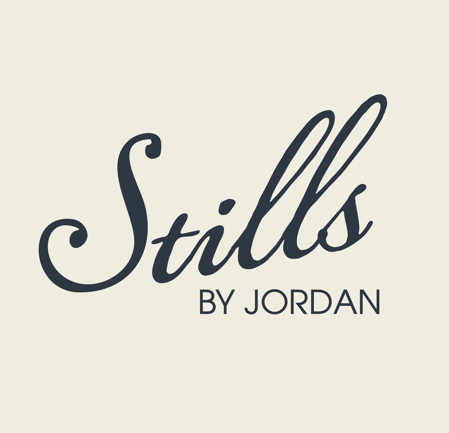 A handwritten cursive signature in dark blue ink against a light background.