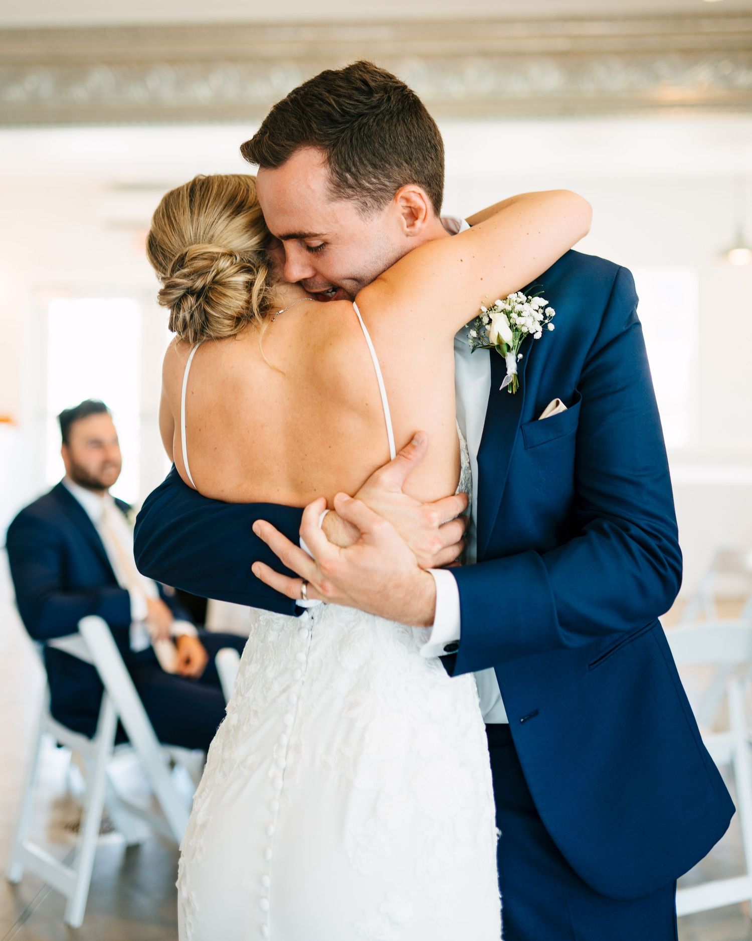 A sweet first look moment between a bride and brother before her wedding ceremony.