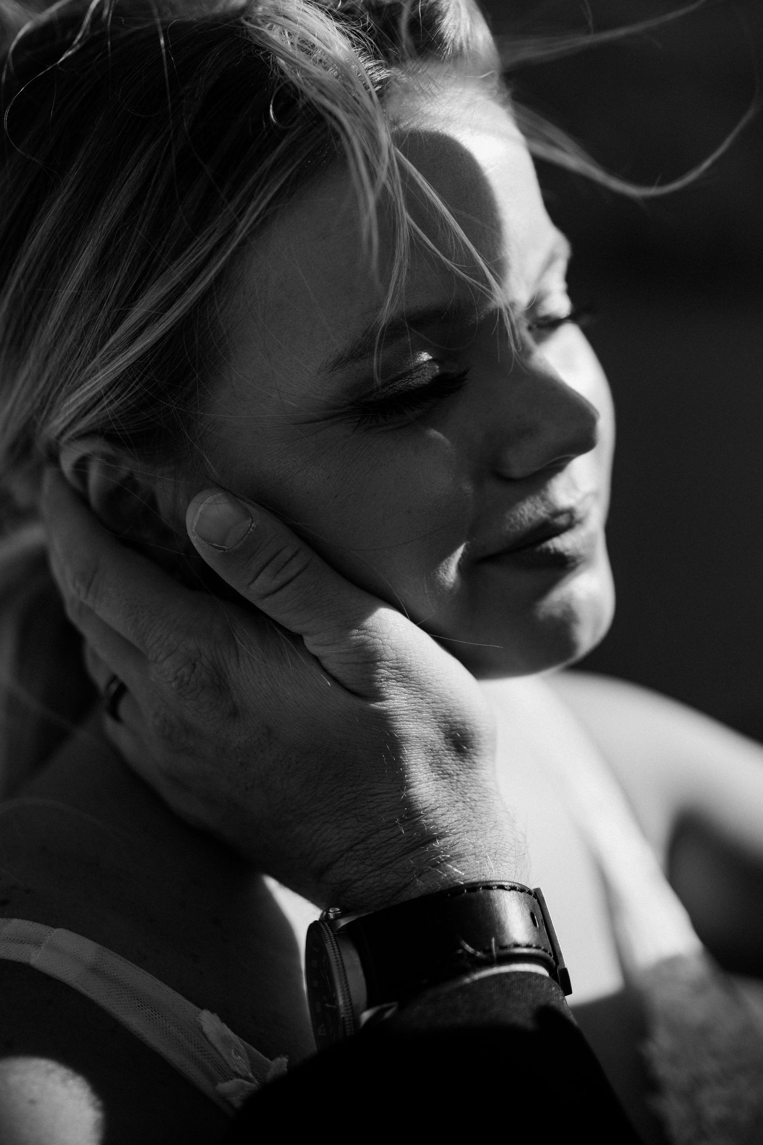 Whitefish Montana Wedding Photography of a bride's face being caressed by her groom.