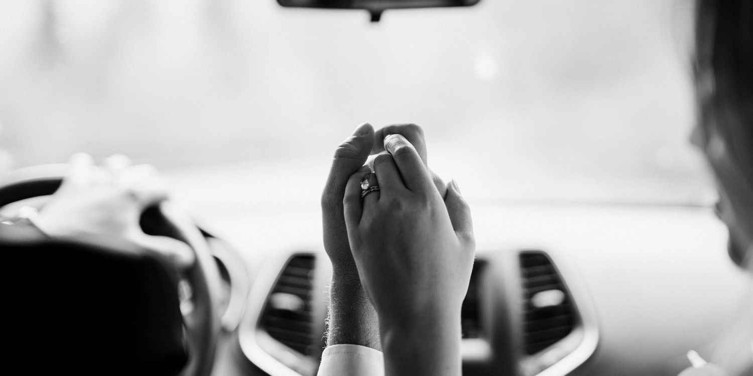 Black and white intimate moment captured in soft focus.