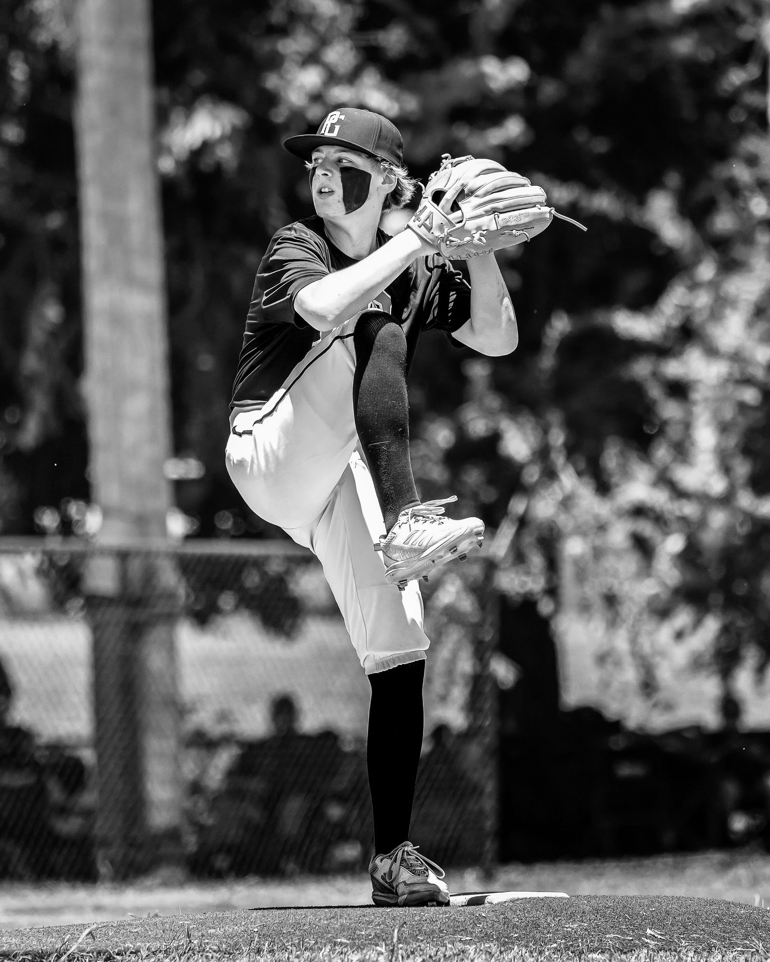 Baseball pitcher shown in a sequence of motion frames demonstrating proper throwing mechanics during delivery.
