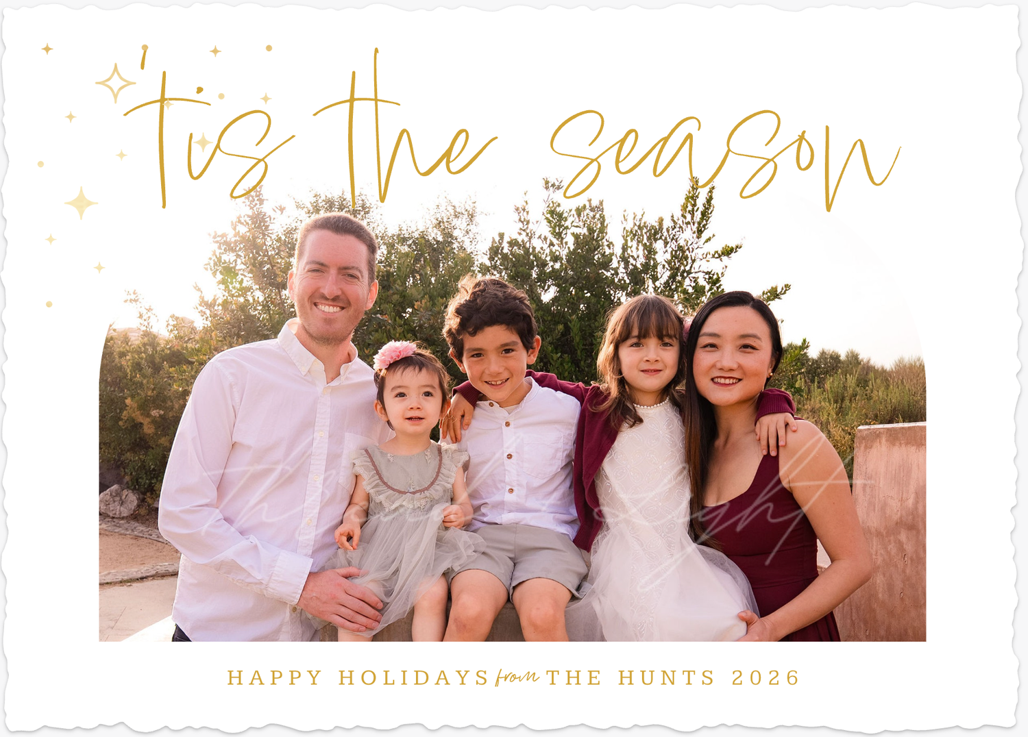 A holiday card featuring a family photo of five all smiling at looking at the camera, which was designed directly from their online gallery