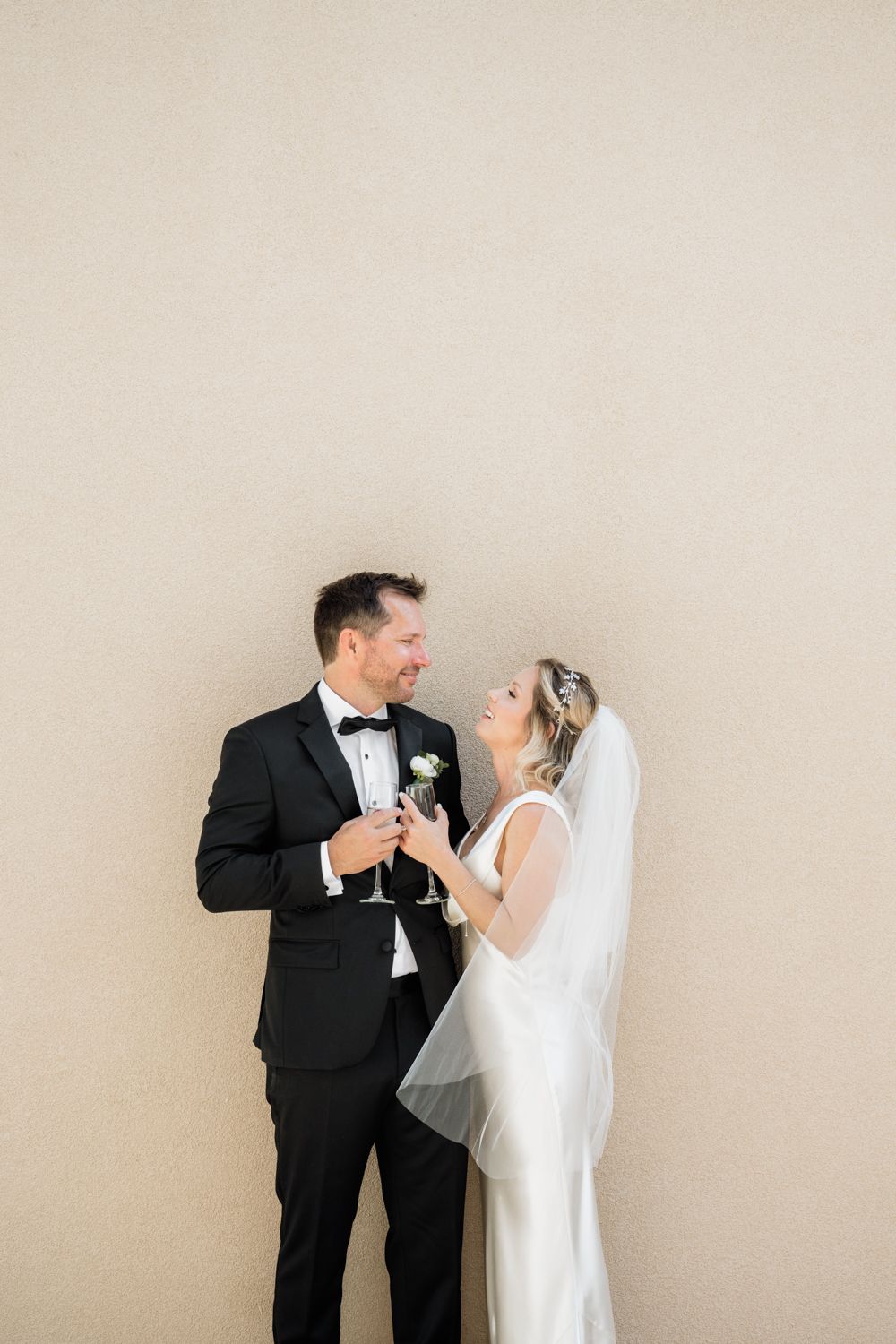 Minimalistic wedding couple portrait cheering