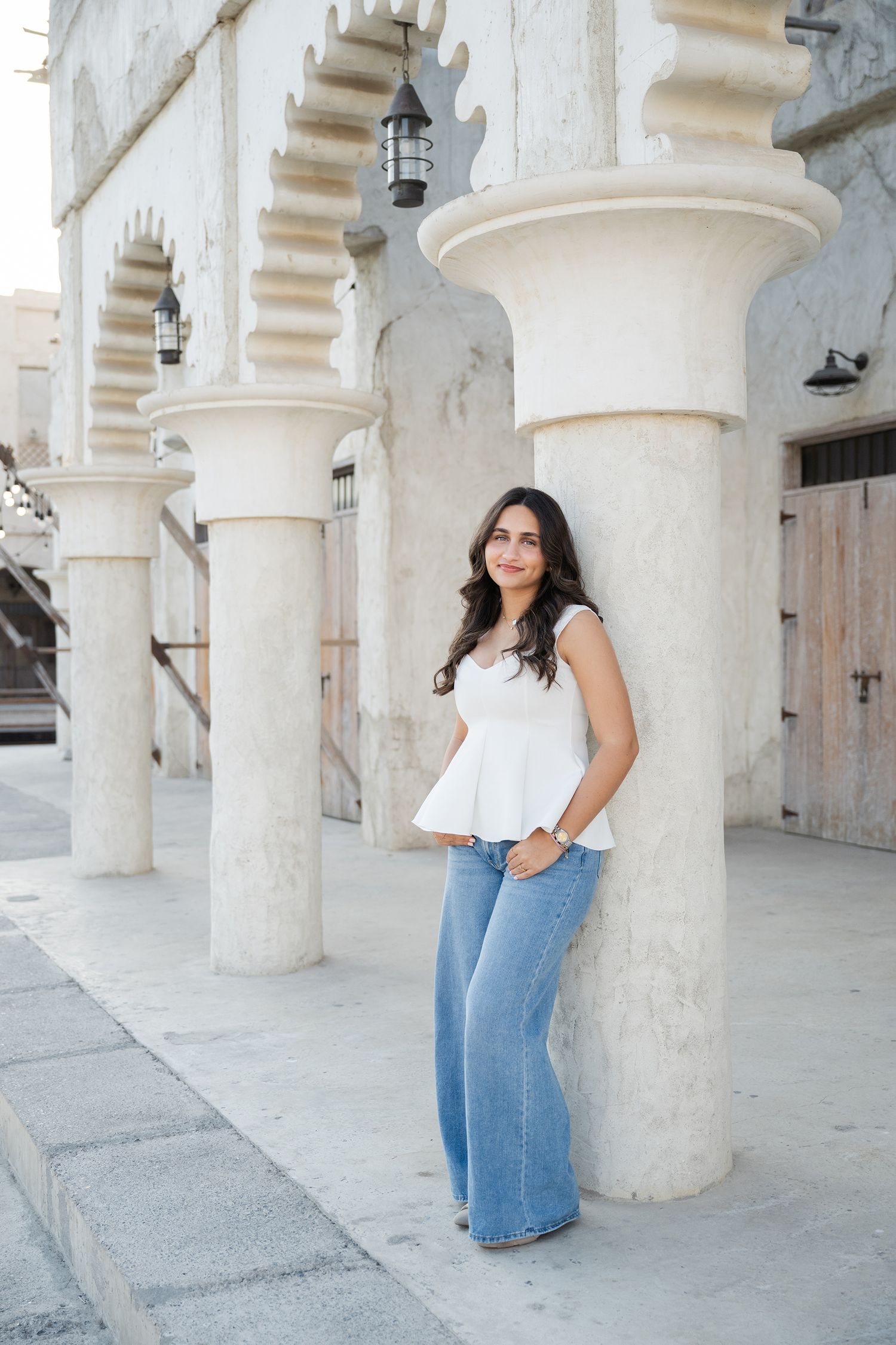 Senior session girl in Al Seef Dubai leaning on column