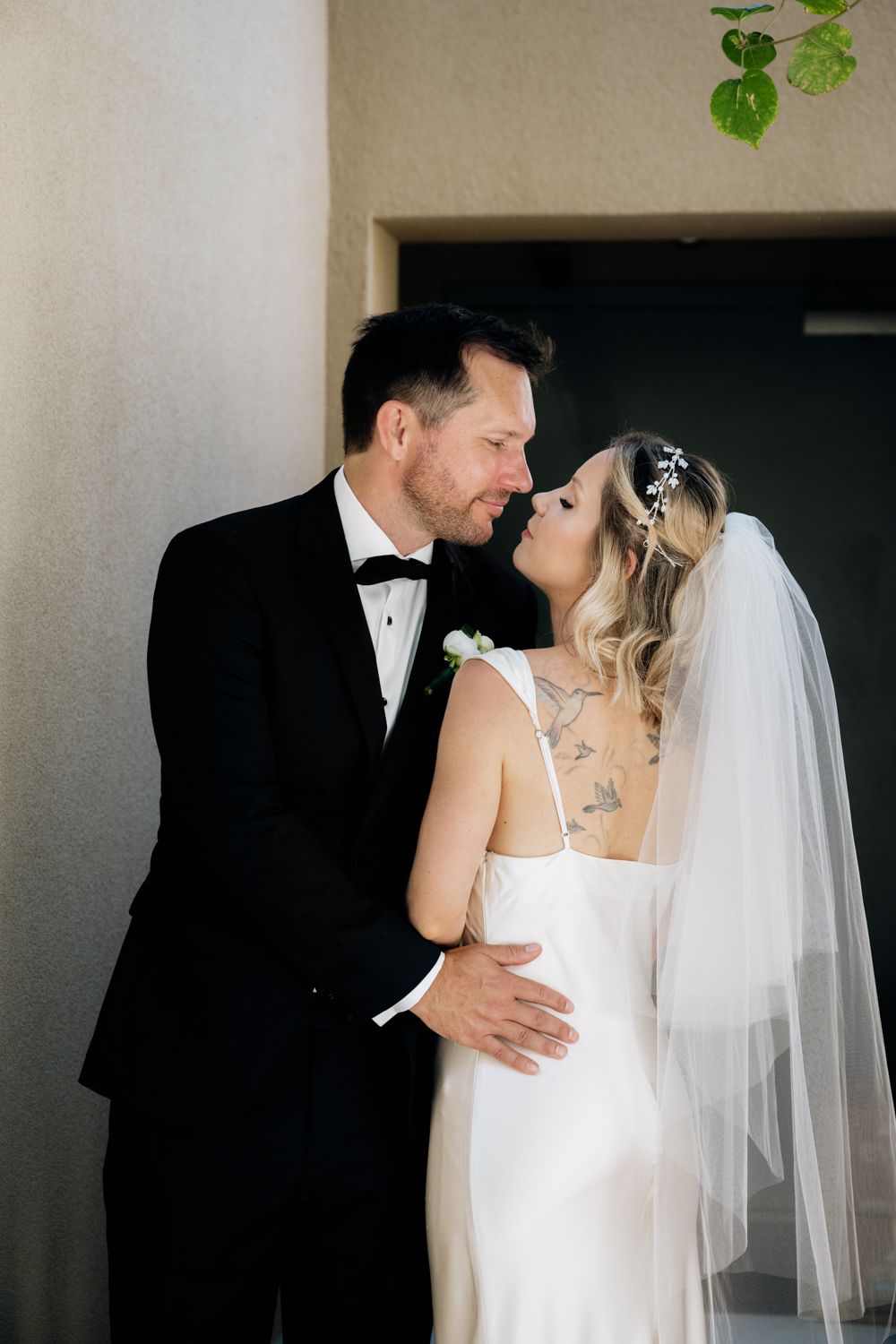 Minimalistic wedding couple portrait kissing
