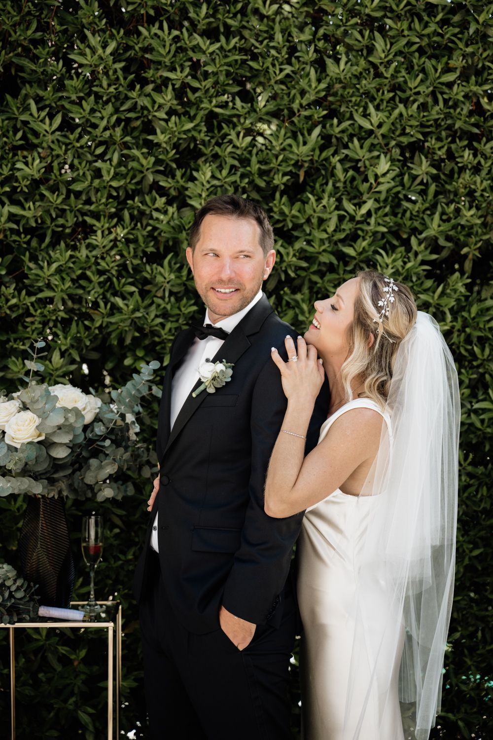 Small wedding garden ceremony bride over groom shoulder