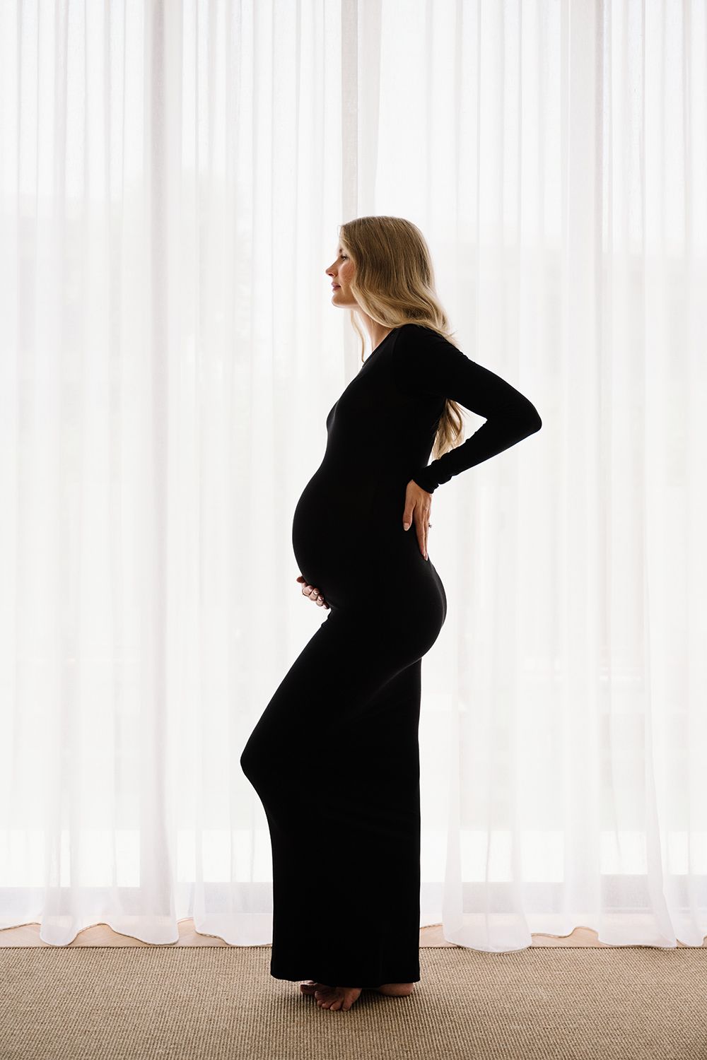 maternity photo session at home black dress