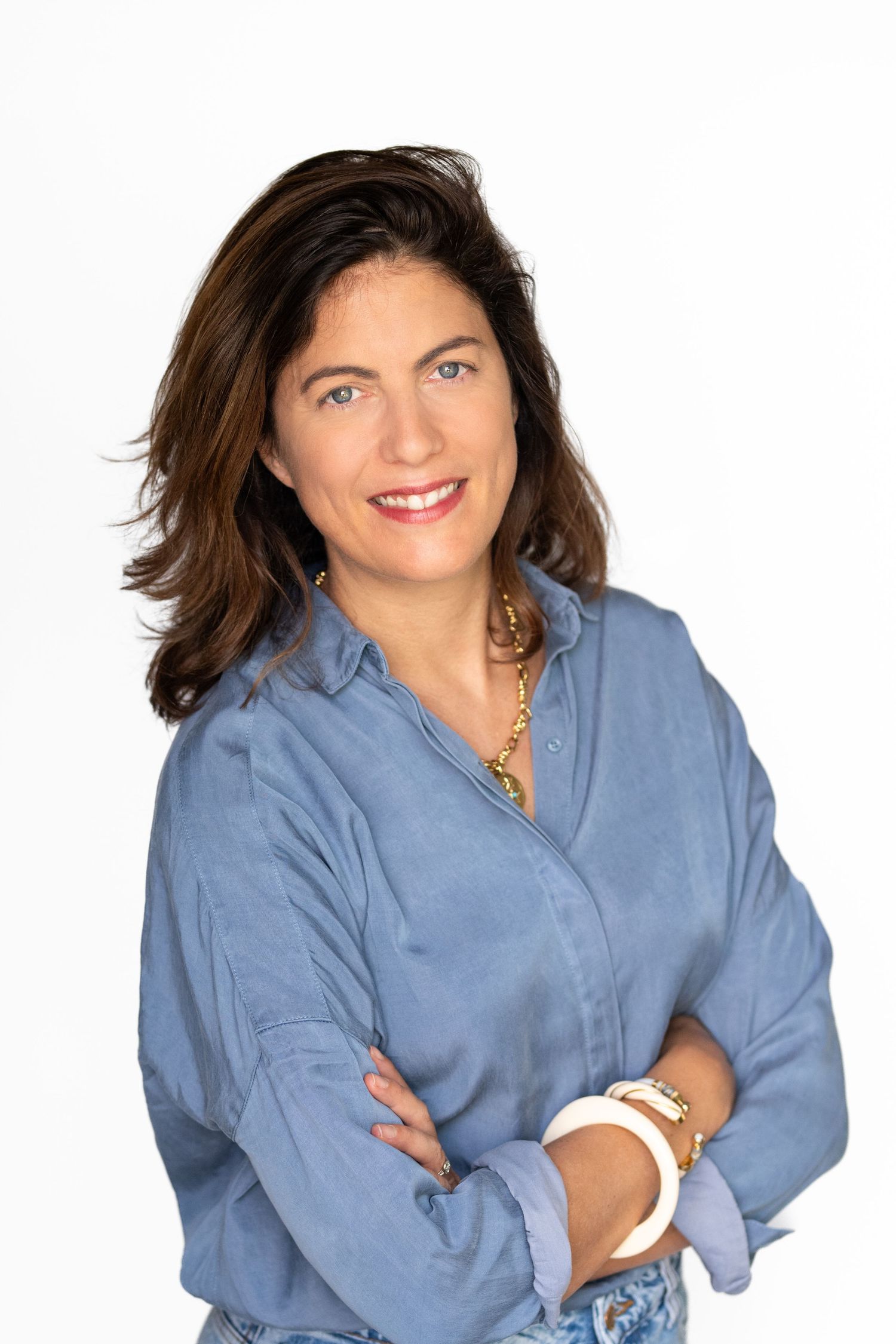 Series of casual professional portraits in a light blue button-down shirt.