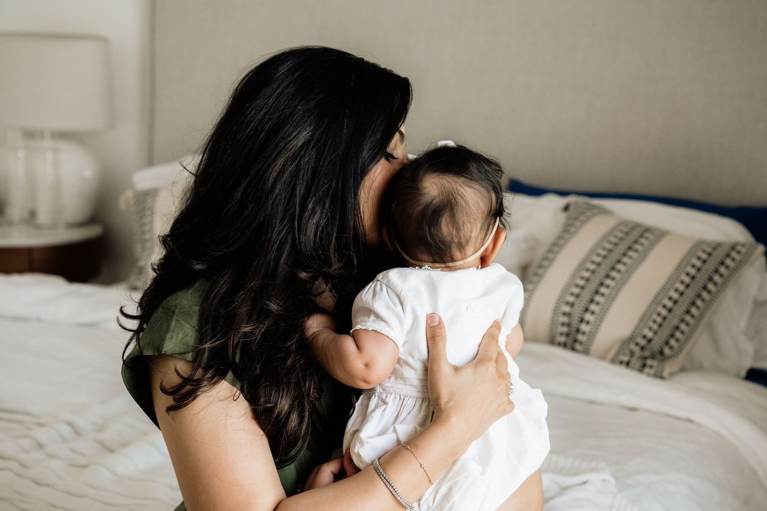 Lifestyle photography series capturing loving parent-child moments in natural light.