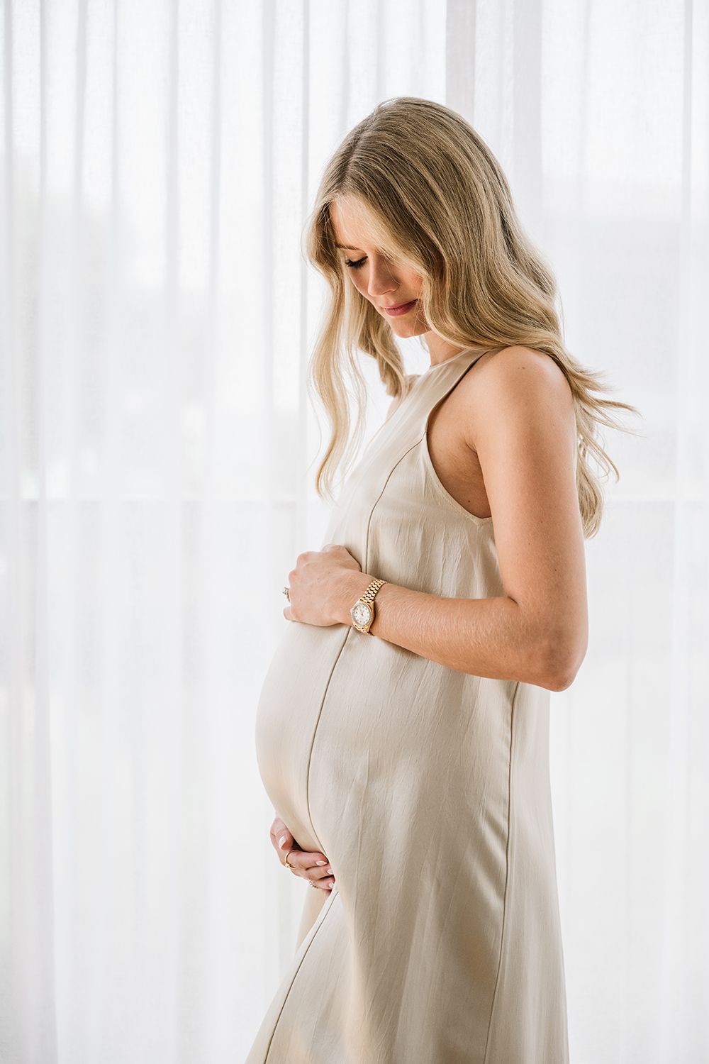 maternity photo session at home satin dress