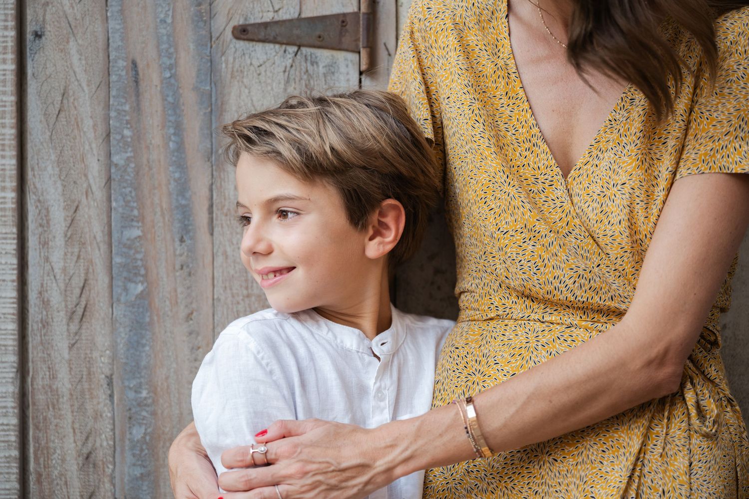 Intimate family portraits featuring yellow dress details against neutral background.