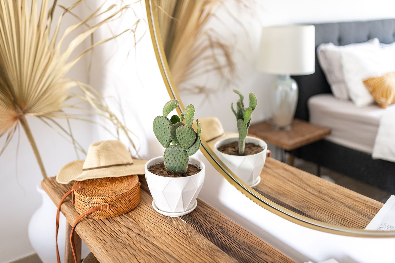 Decorative dried palm leaves and wooden accents on display in a bright interior setting.