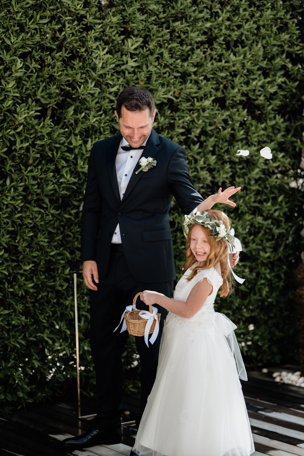 Flower girl throwing flowers