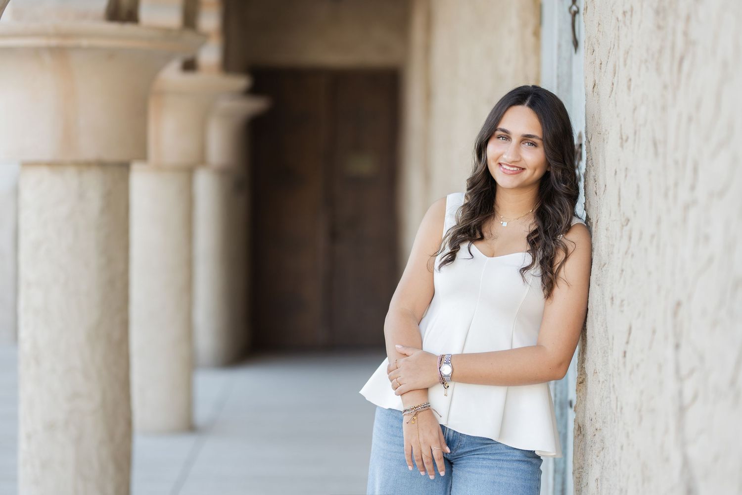 Senior session girl in Al Seef Dubai leaning on wall