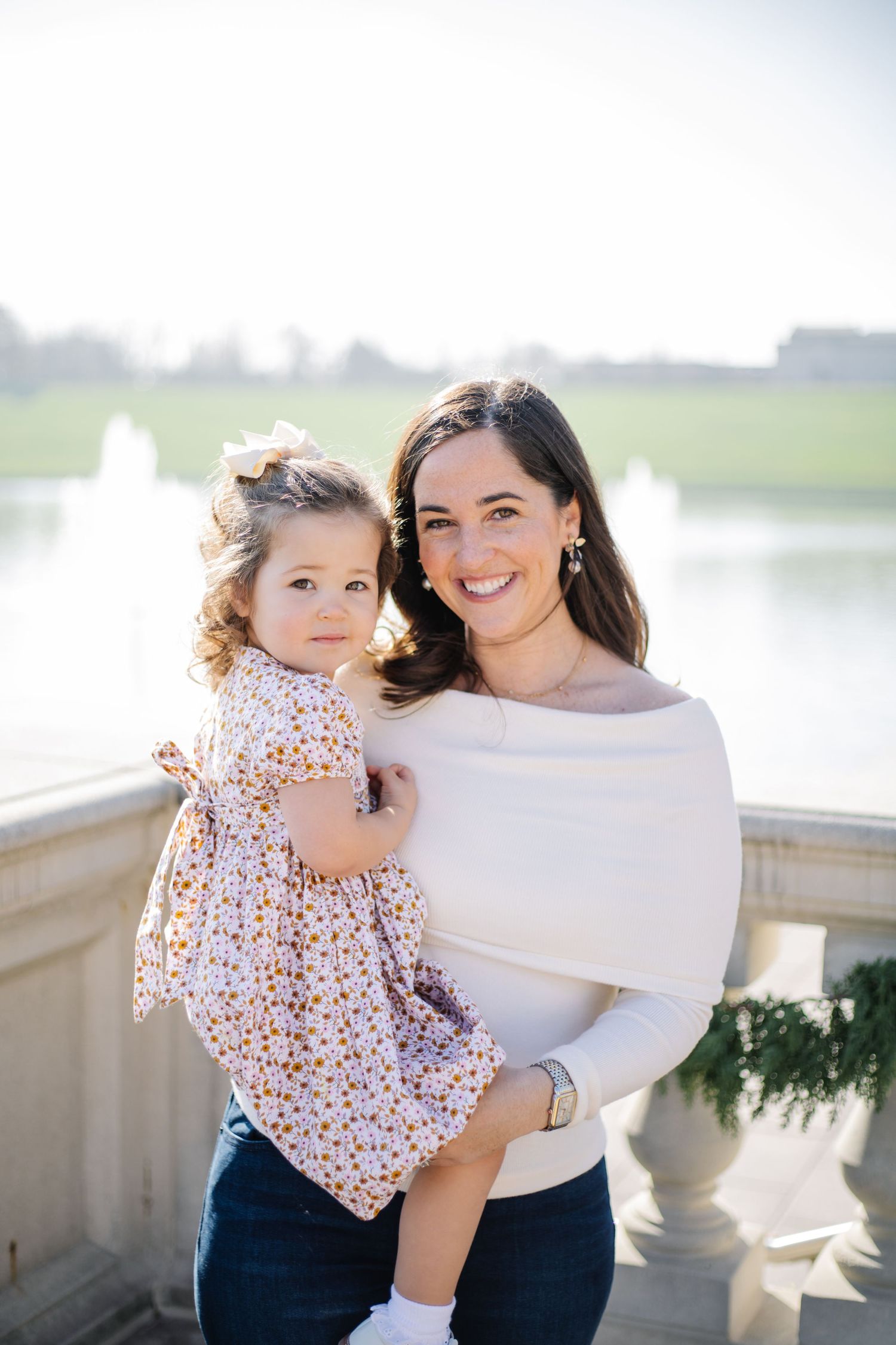 Candid lifestyle photos show loving interaction between parent and child against a bright background.
