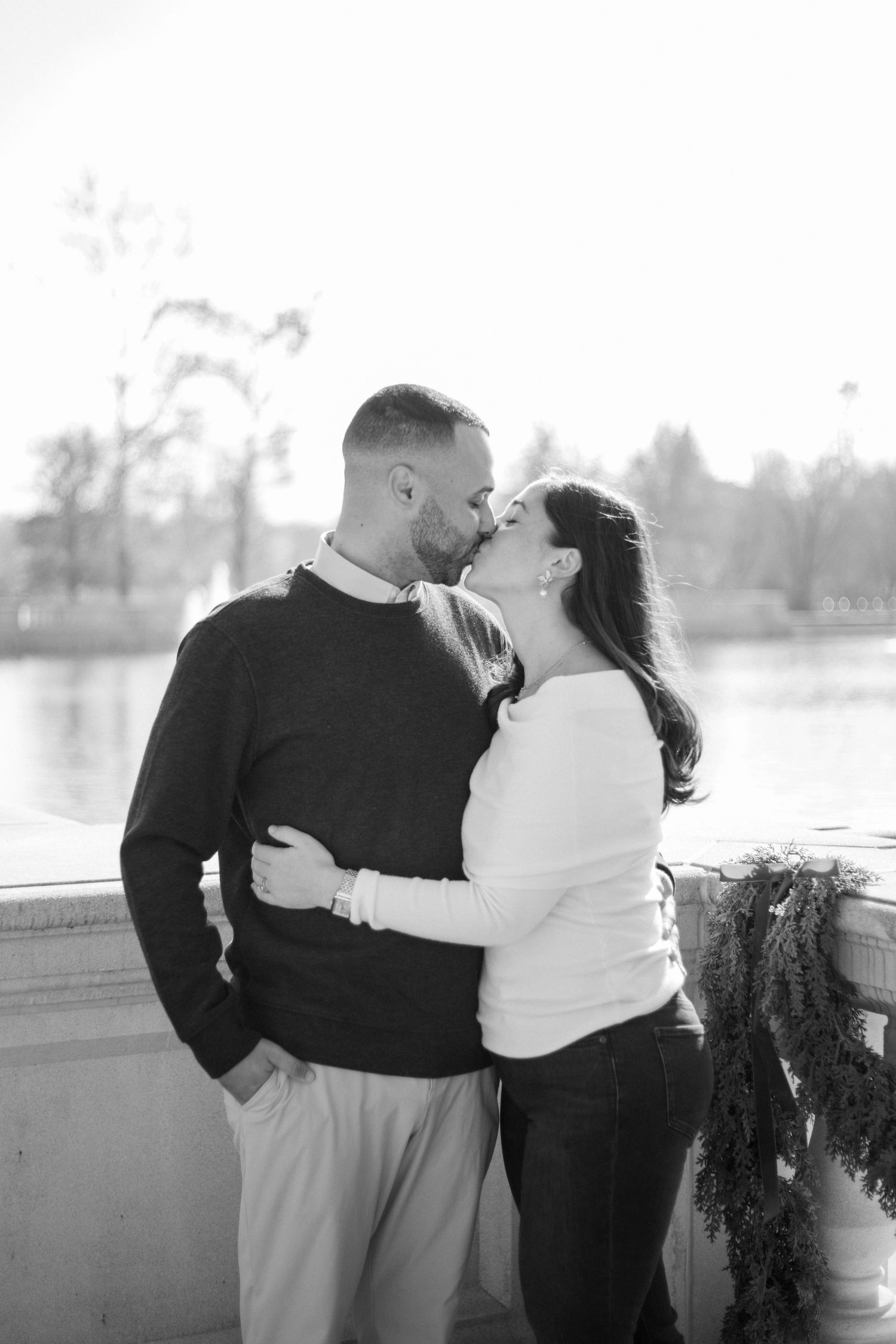 An intimate couple's portrait session captured on a decorated stone balcony.