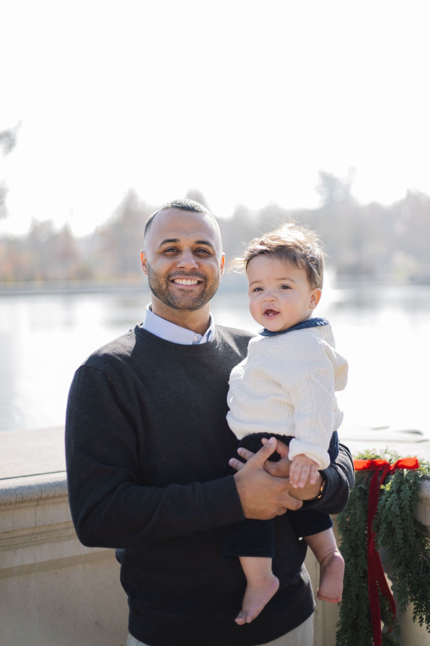 A series of candid outdoor photos showing joyful moments between an adult and baby against a bright background.