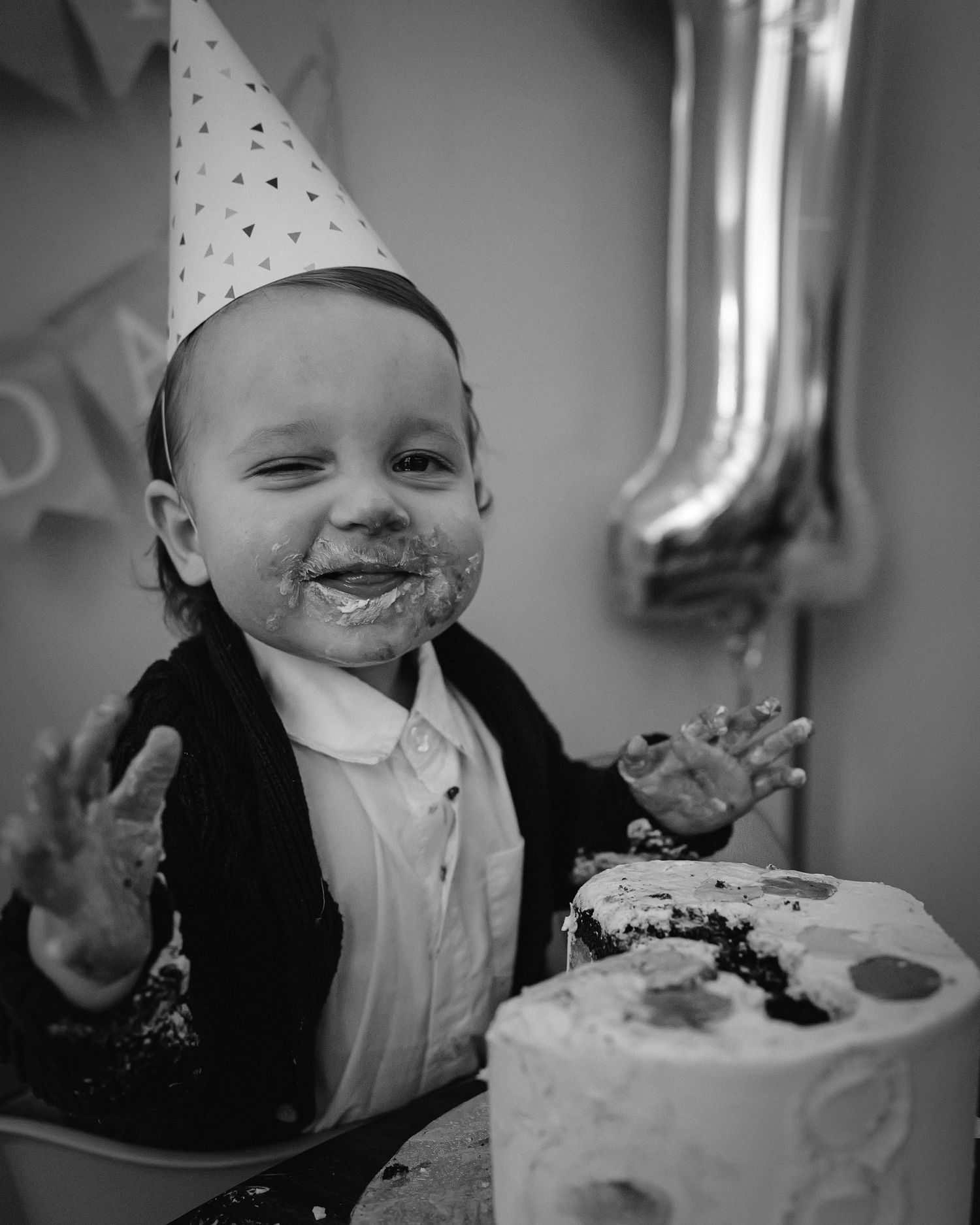 A series showing messy cake smash fun with frosting covered smiles and party hat celebrations.