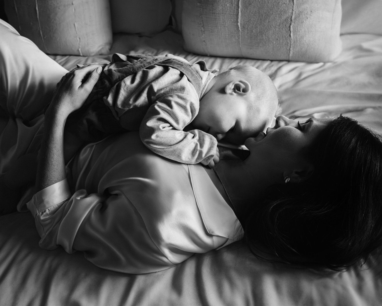 Black and white intimate portrait in soft window light.