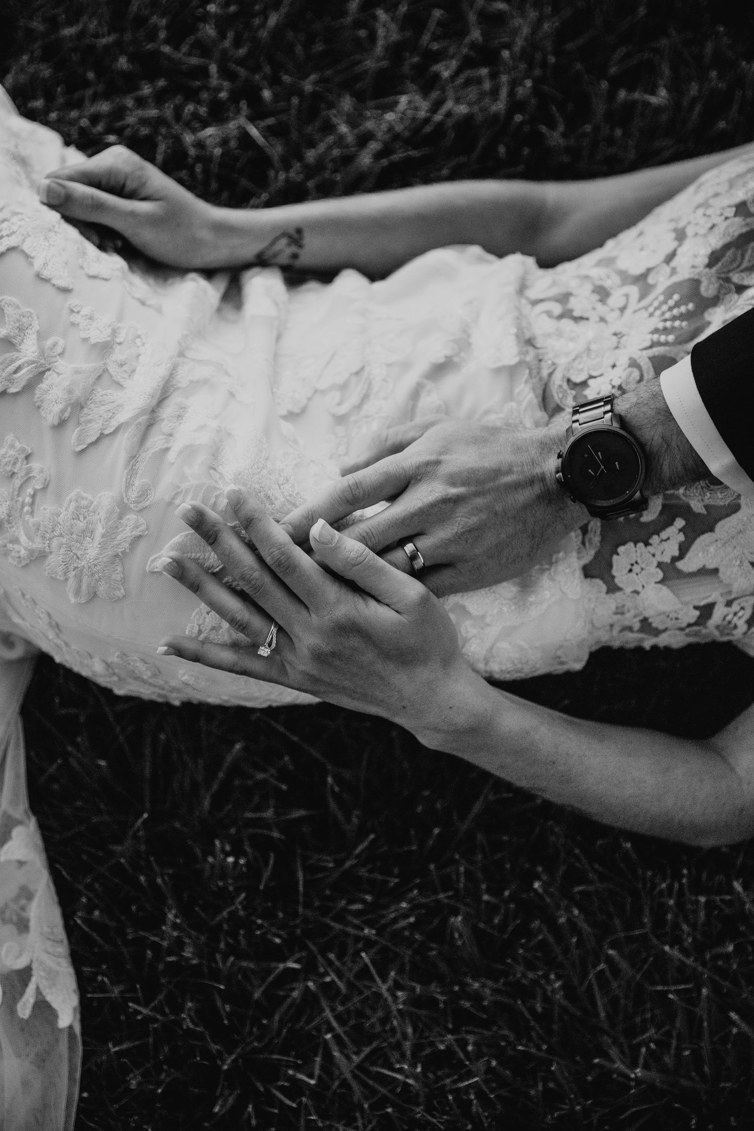Black and white detail shots of hands with lace and wedding rings.