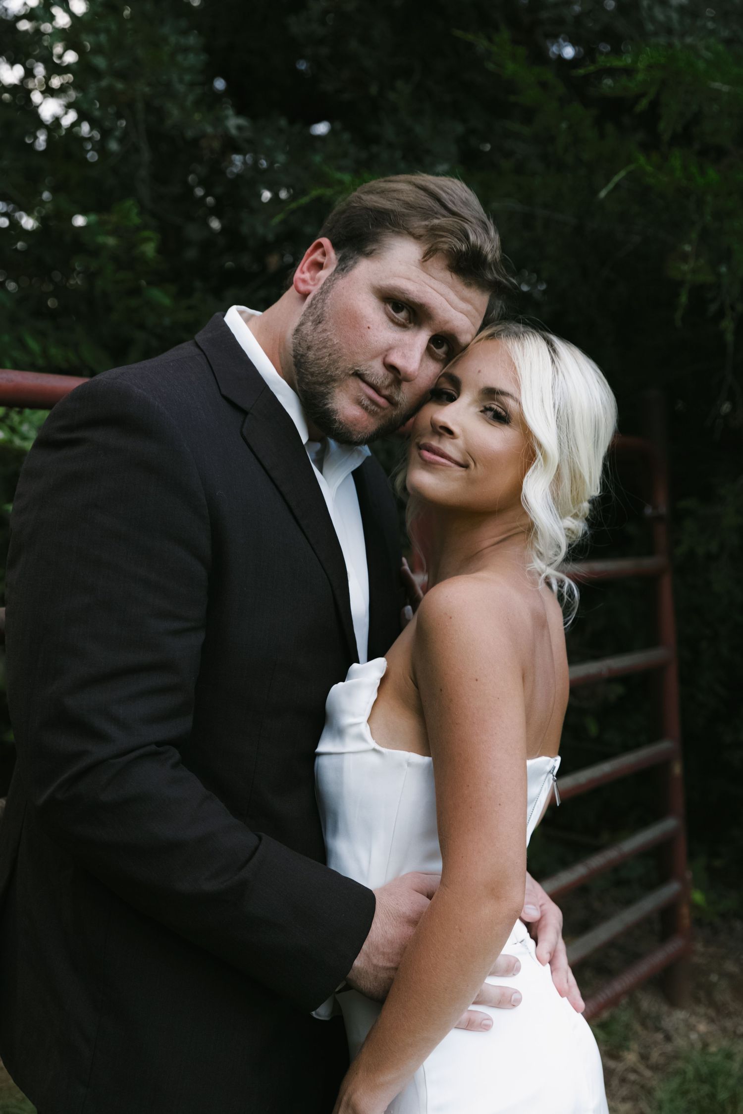 Artistic black and white wedding portraits showing intimate moments between newlyweds.