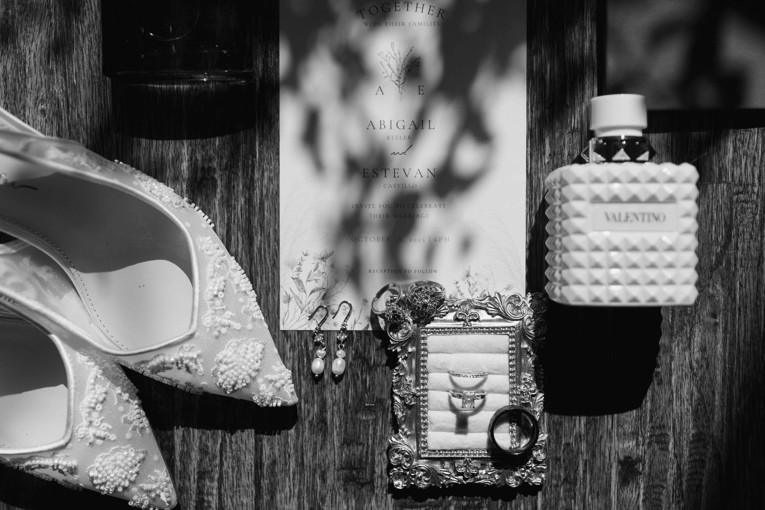Black and white wedding detail photos showing rings, shoes, cake, and decor elements arranged in a grid layout.