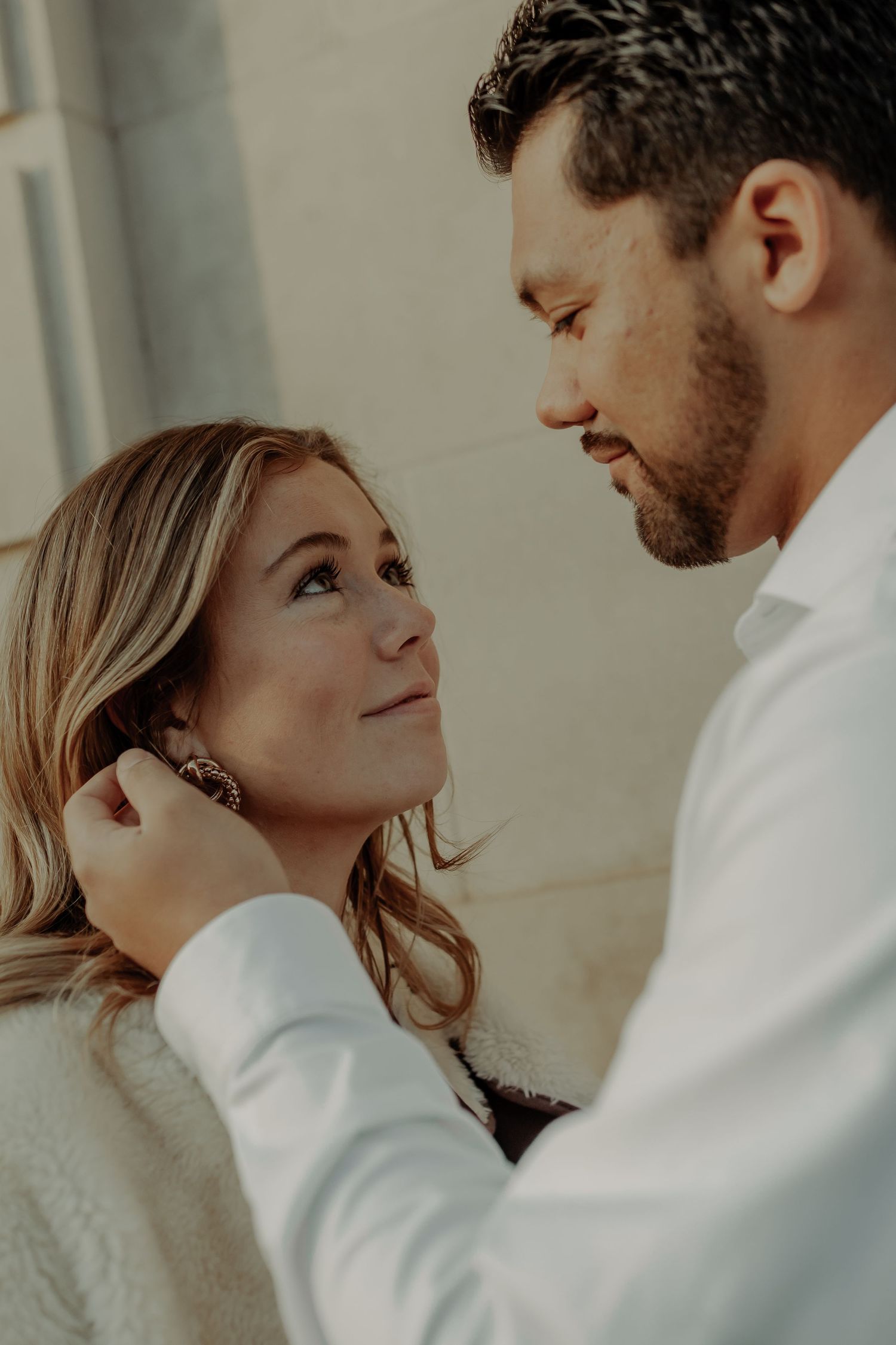 engagement or couple photography of man tucking hair behind girls ear, grand junction colorado photography