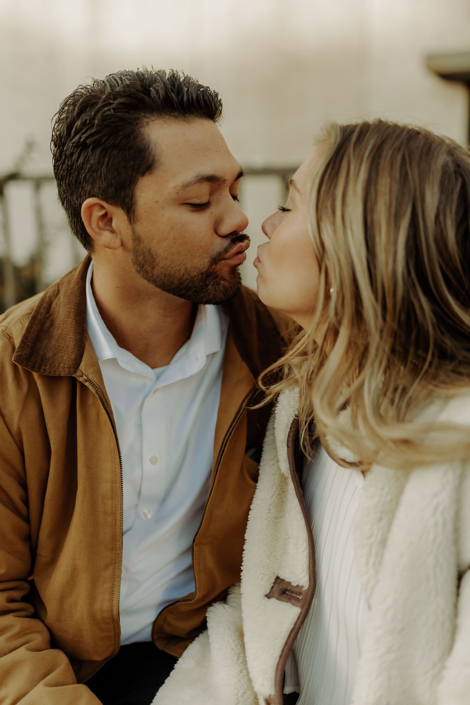 couple pictured kissing in downtown grand junction photoshoot