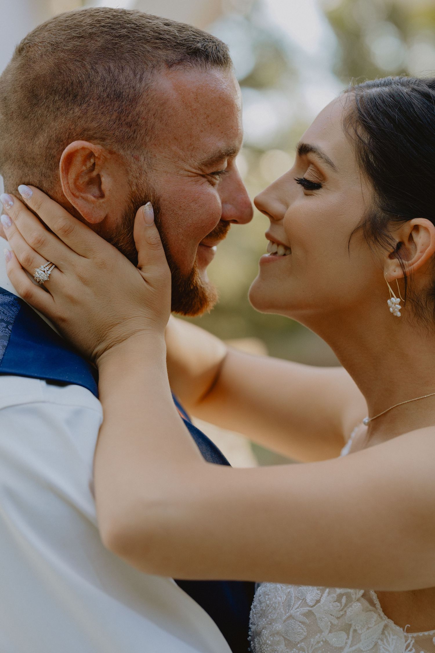 Bride and groom embrace on their wedding day in Delta, CO. A candid, romantic moment captured by a Western Colorado wedding photographer.