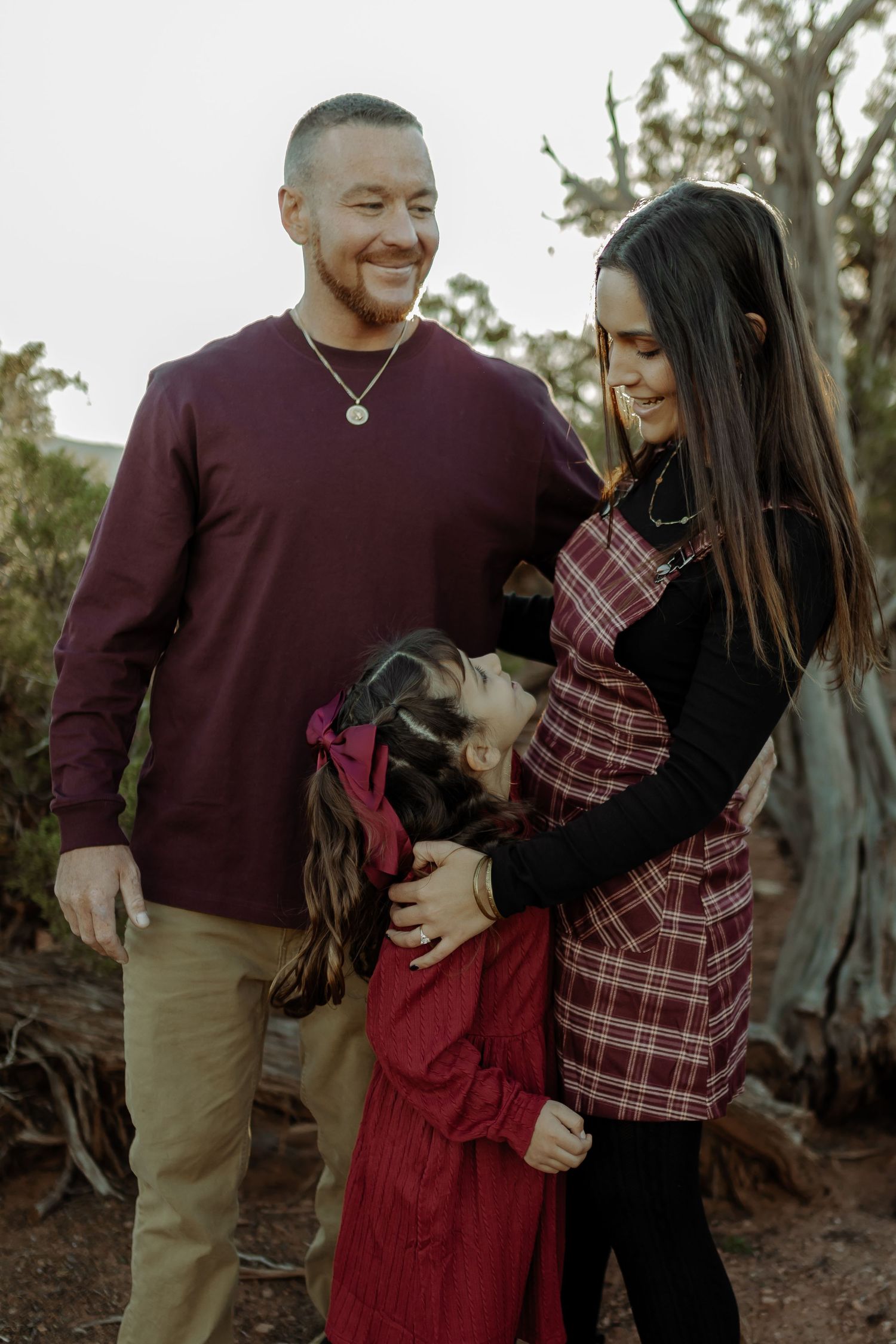 family photography and photoshoot in grand junction colorado, colorado national monument family session, family standing and smiling