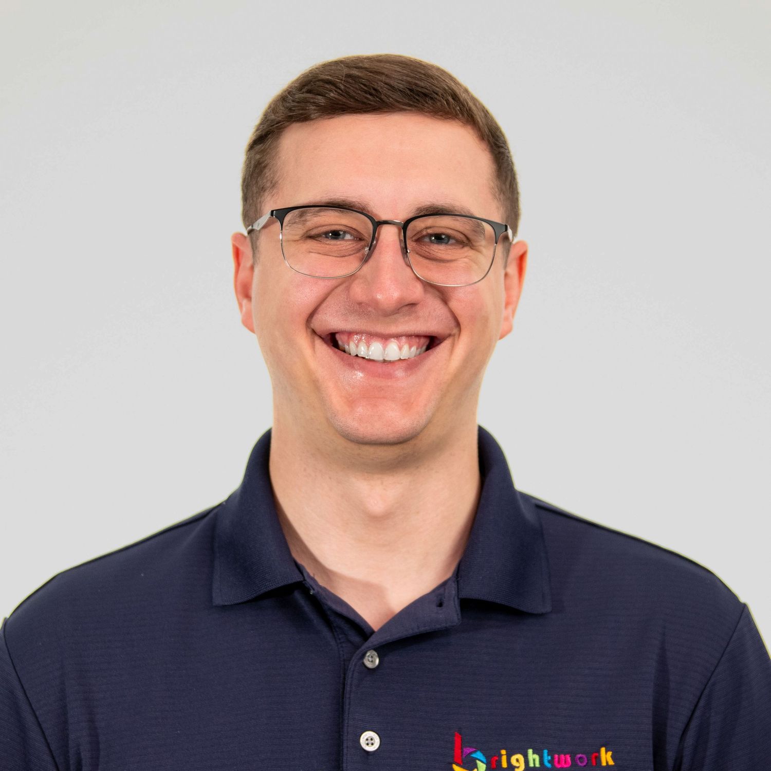 High-quality headshot of a photographer ready to level up your real estate photography and marketing in Jacksonville, FL