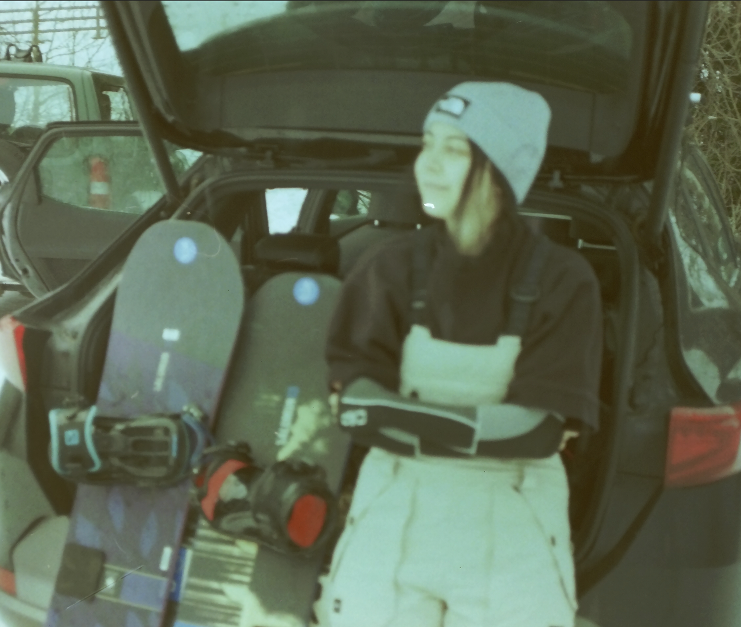 Camera equipment and gear loaded in the back of a vehicle trunk.