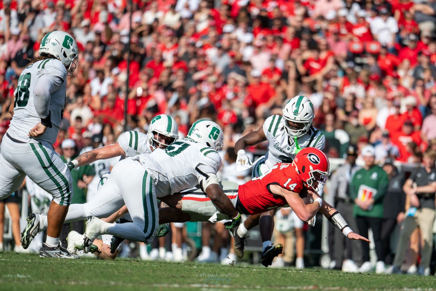 Football teams face off at the line of scrimmage during a match.