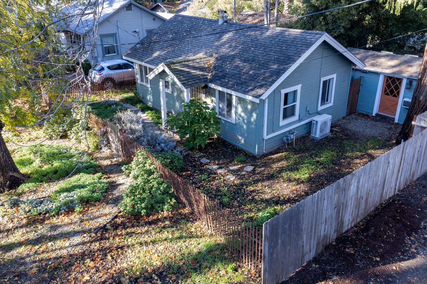 Real Estate small houes Elavated Drone shot right front corner