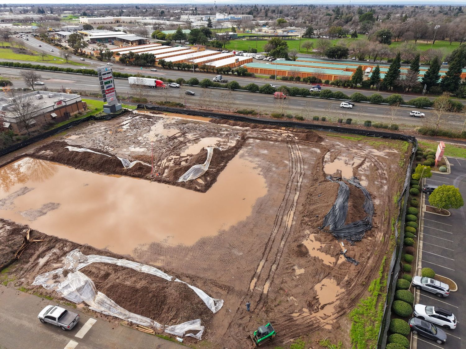Aerial drone photo documenting construction site conditions and earthwork progress