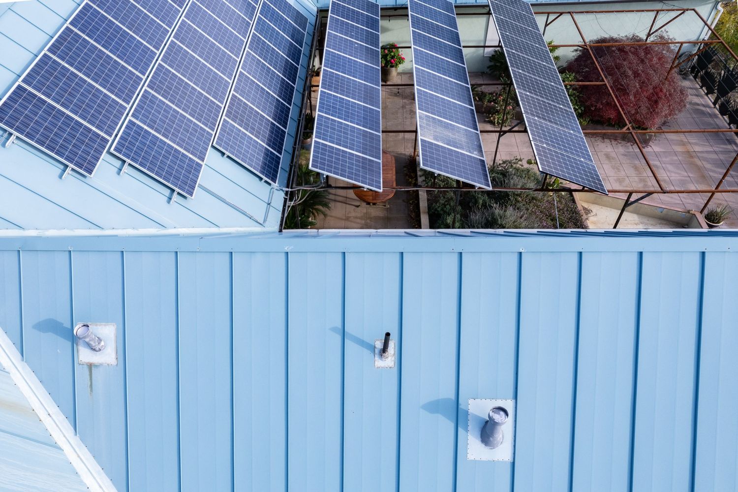 Forest Ranch Roof survey project, showing penetrating roof features and solar pannels. Elevated drone shot