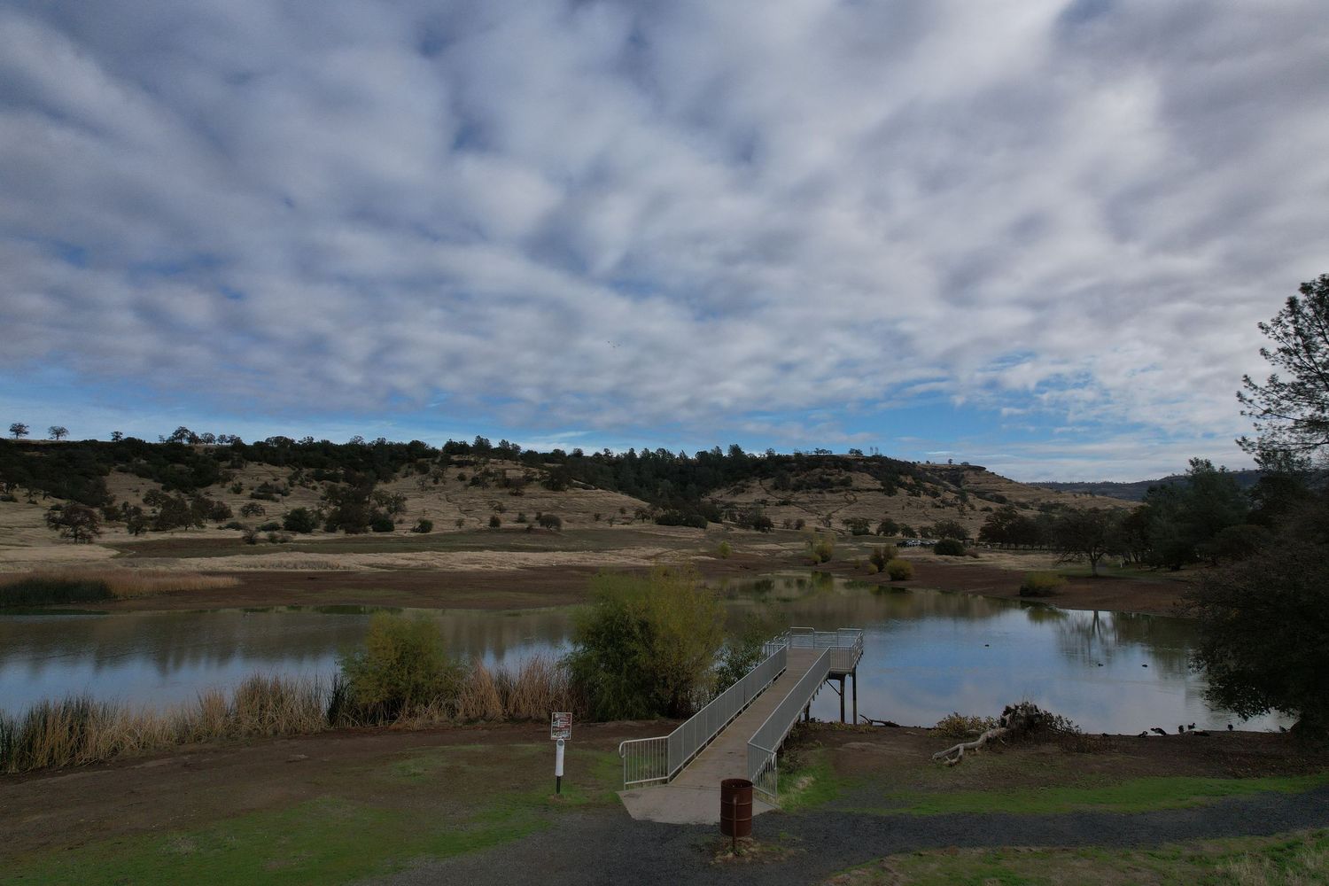 Aerial drone public park showing fishing pier.