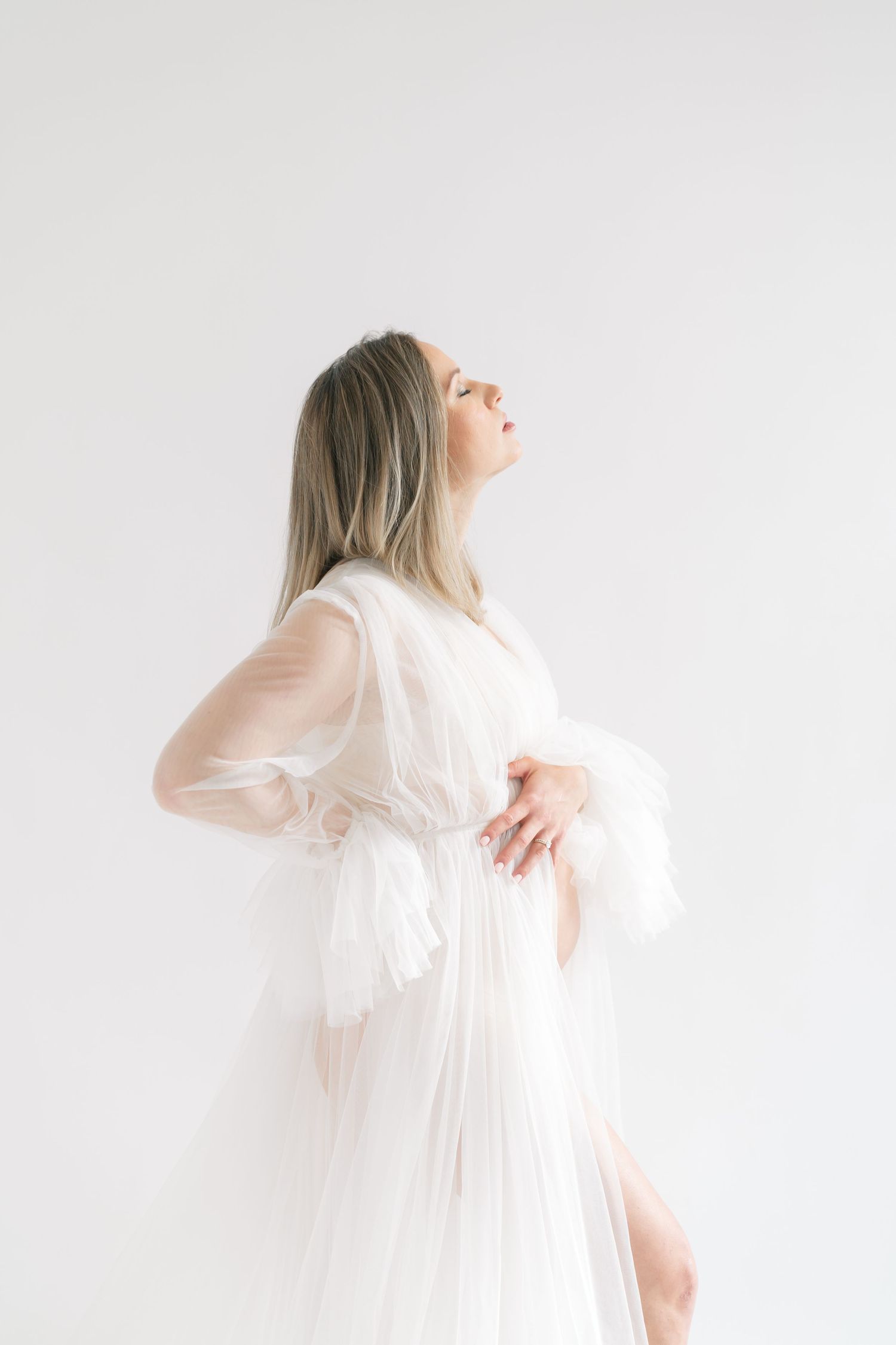 Pregnant mother from the Chicago area enjoying a calm studio maternity session in Valparaiso, Indiana.
