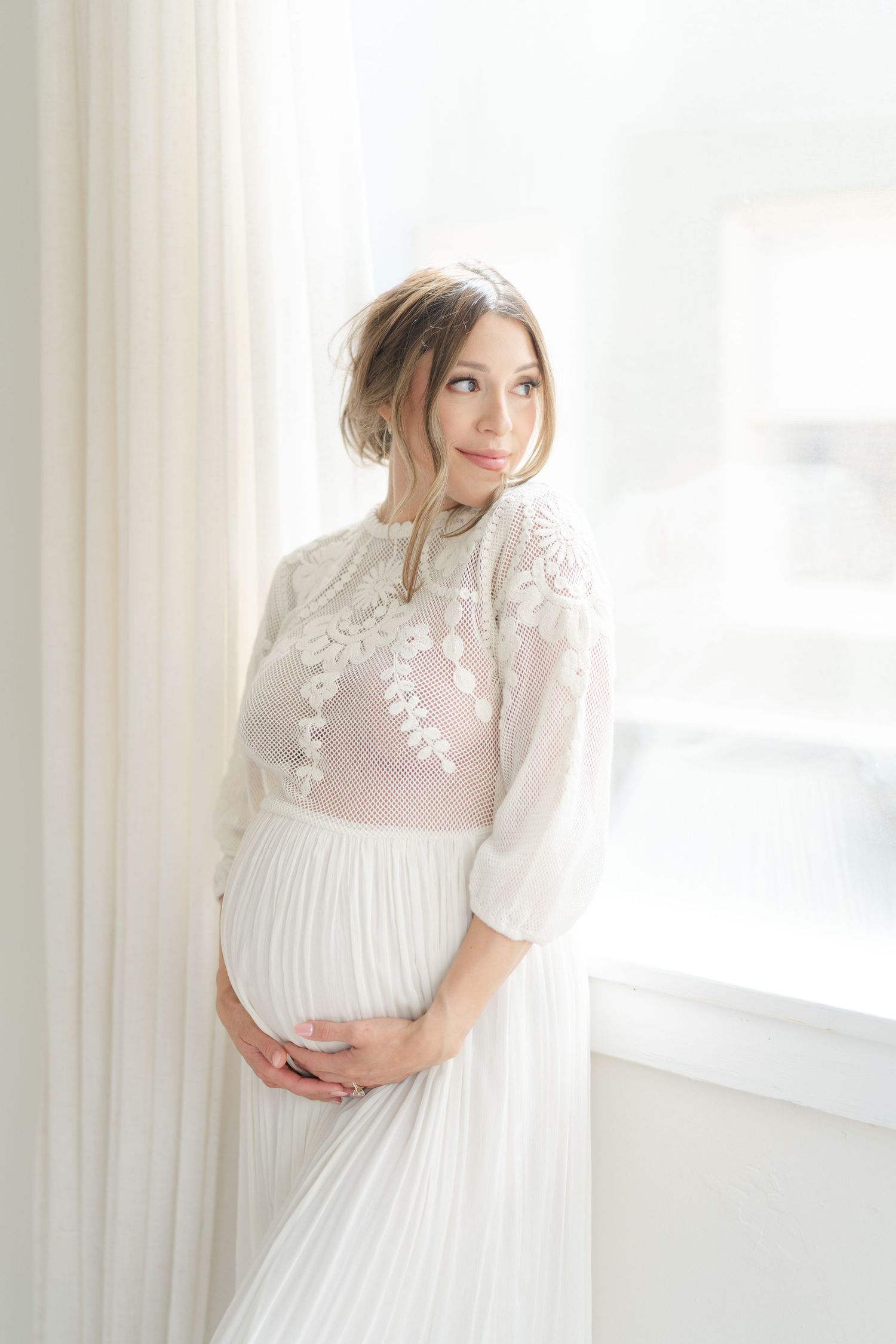 Expecting mother glowing during a studio maternity photography session in Valparaiso, Indiana.