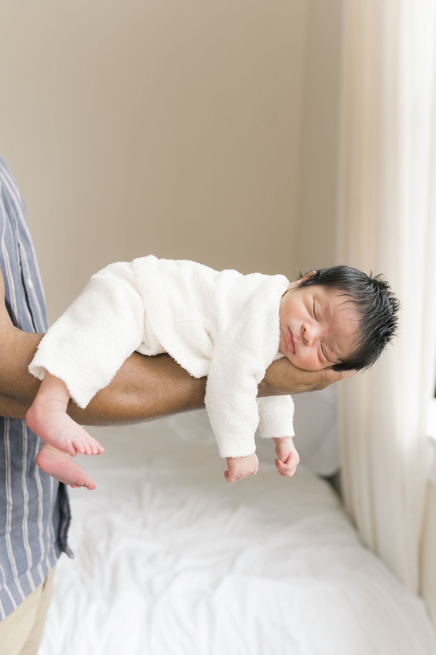Valparaiso, Indiana newborn photographer capturing soft, natural studio portraits of a newborn baby